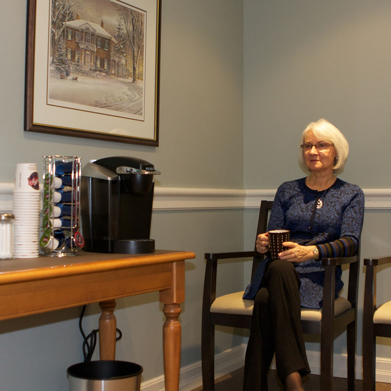 Enjoying a cup of coffee in the waiting room of our Davidson Hearing Aid Centres Nepean clinic