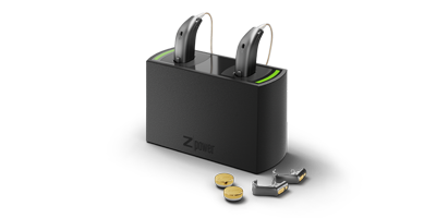 Oticon Opn hearing aids with rechargeable batteries being charged with the Power charging system