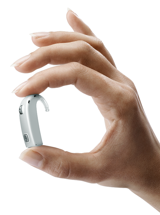 Hand holding Oticon Dynamo hearing aid